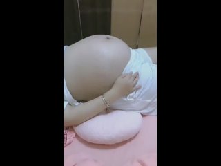 pregnant asian laying down